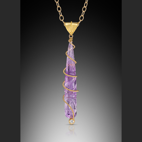 Amethyst Swirl pendant 22 k bail and 18 k gold swirl with a diamond chain sold separately